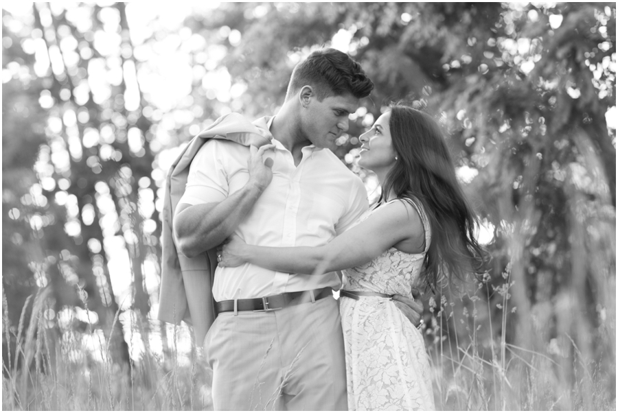 Sunset Engagement Photographer - black and white couple in a field - Havre de Grace sunset engagement photography