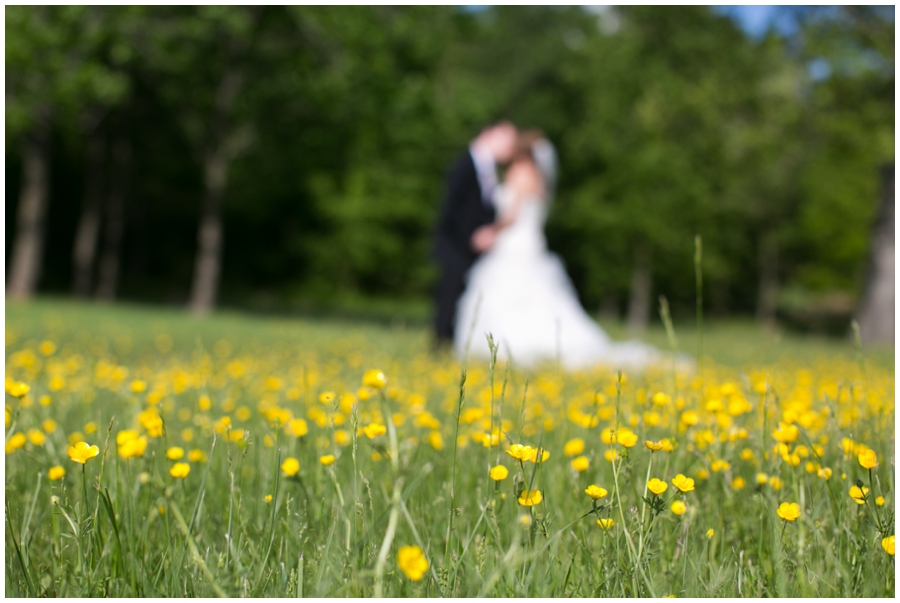 The Vineyards at Lost Creek Wedding Photographer - Vineyard yellow flower bride and groom