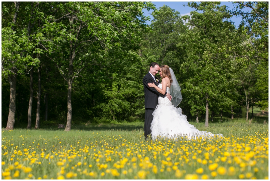 The Vineyards at Lost Creek Wedding Photographer - Vineyard yellow flower bride and groom