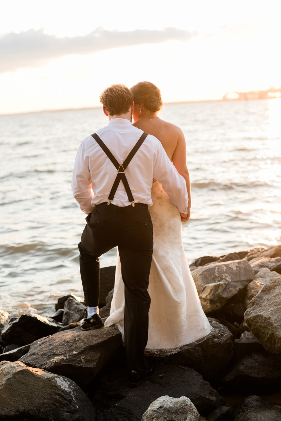 Couple on the rocks at sunset for a shore Wedding by Philadelphia wedding photographer