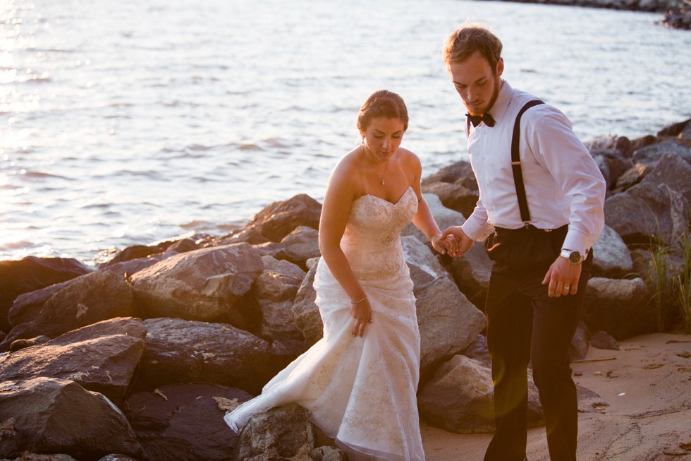 Couple on the rocks at sunset for a shore Wedding by Philadelphia wedding photographer