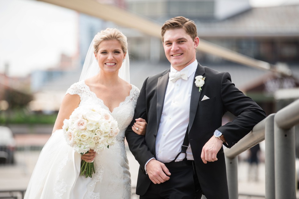 Wedding couple on the baltimore harbor at Fleet Street Bridge