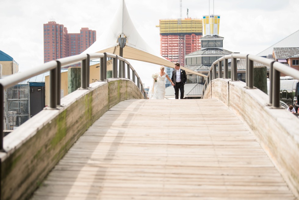 Wedding couple on the baltimore harbor at Fleet Street Bridge