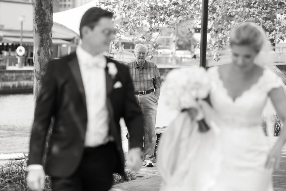 Wedding couple on the baltimore harbor at Fleet Street Bridge