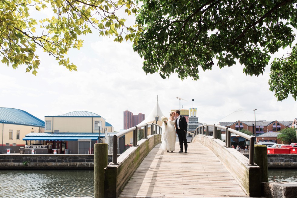 Wedding couple on the baltimore harbor at Fleet Street Bridge