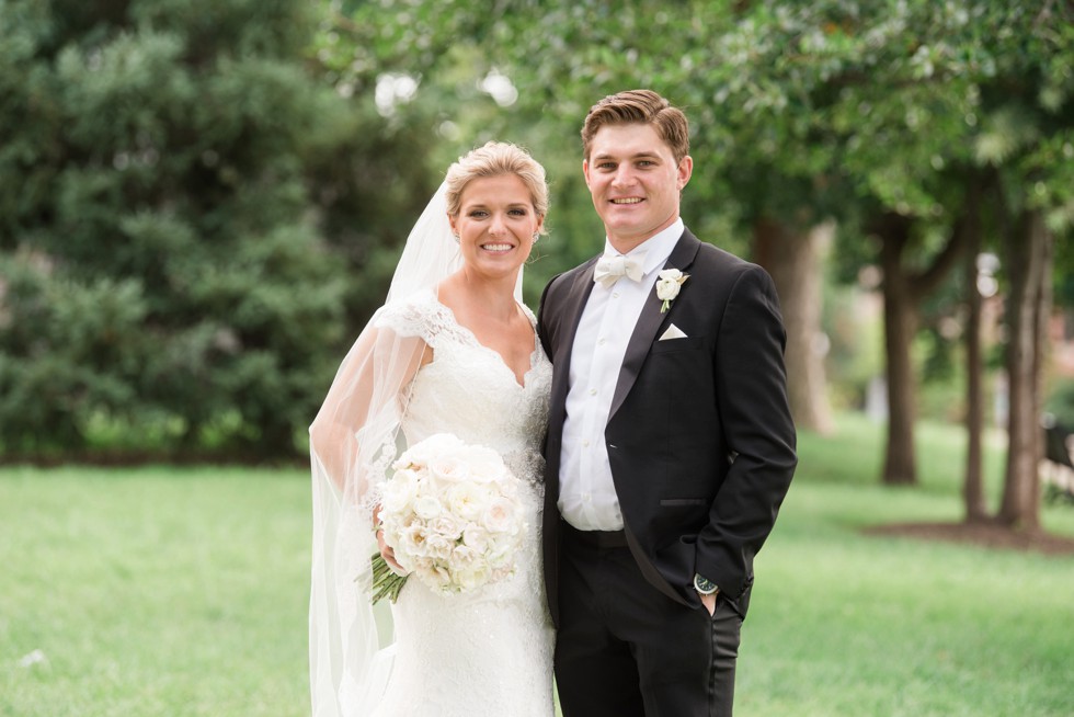 Bride in Kleinfeld's wedding dress with cathedral veil at Federal Hill Park