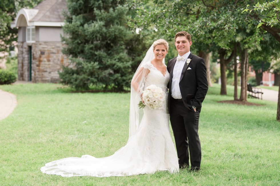 Bride in Kleinfeld's wedding dress with cathedral veil at Federal Hill Park