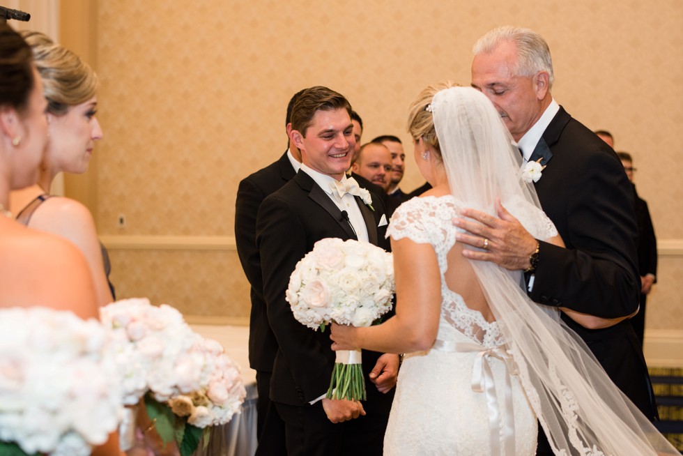 Bride walking down the aisle Indoor Wedding ceremony at Baltimore Waterfront Marriott