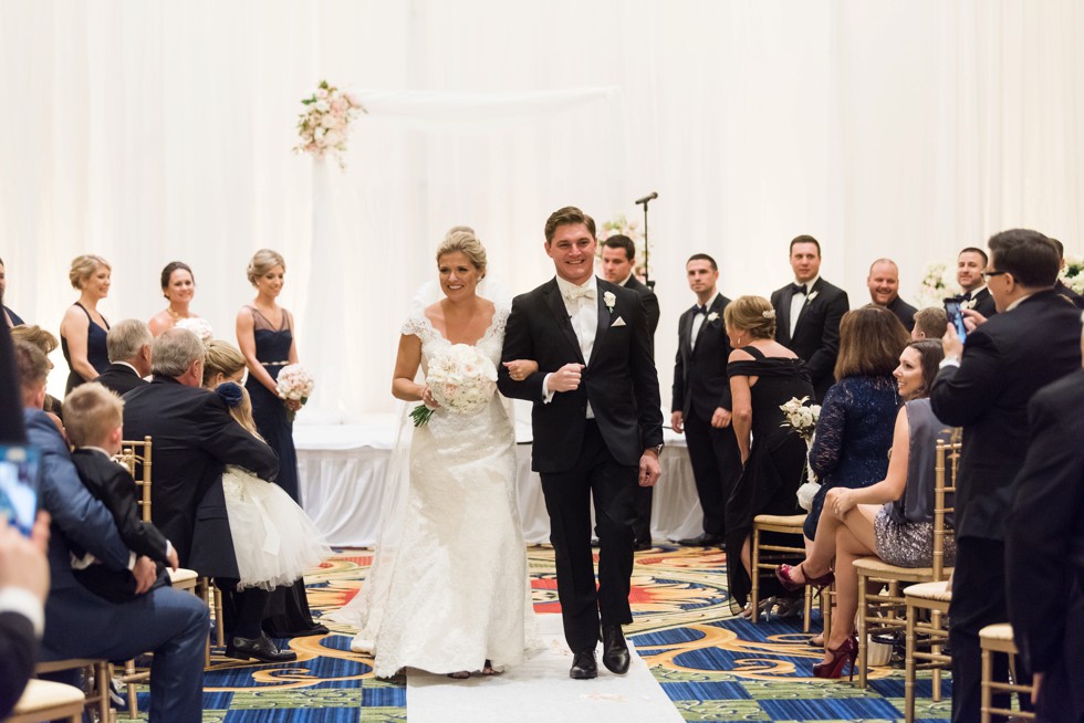 Bride walking down the aisle Indoor Wedding ceremony at Baltimore Waterfront Marriott