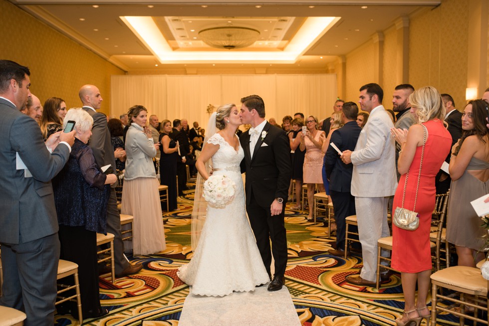 Bride walking down the aisle Indoor Wedding ceremony at Baltimore Waterfront Marriott