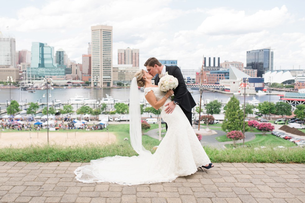 bride and groom dip overlooking the baltimore harbor