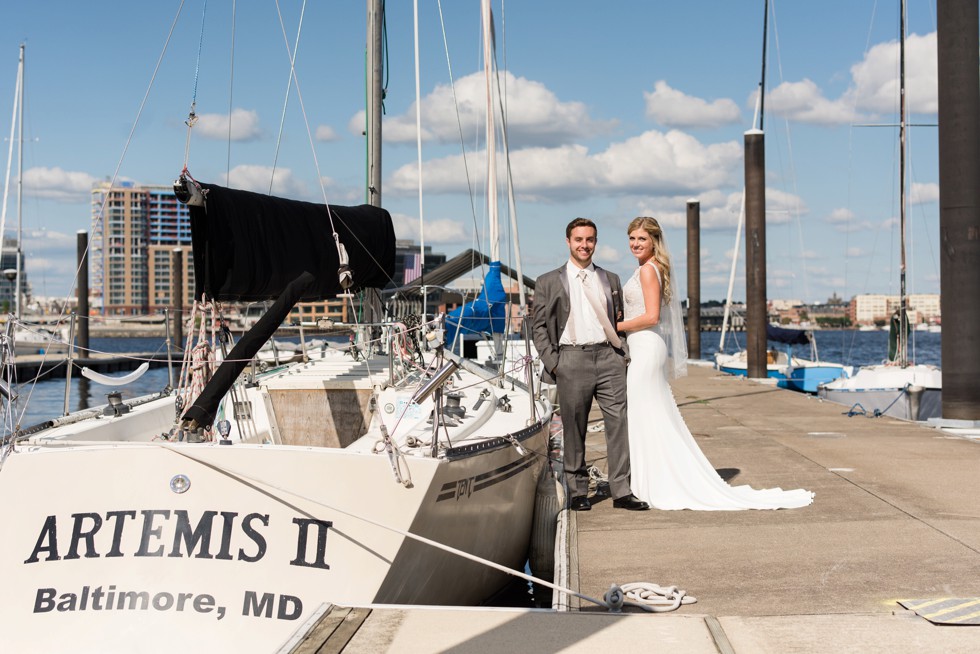 Baltimore Museum of Industry wedding photos with a sailboat on the baltimore harbor