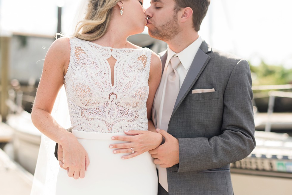 Baltimore Museum of Industry wedding photos with a sailboat on the baltimore harbor