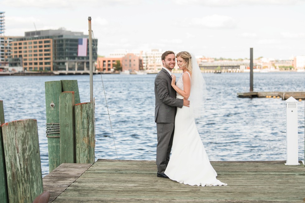 Baltimore Museum of Industry wedding photos with a sailboat on the baltimore harbor