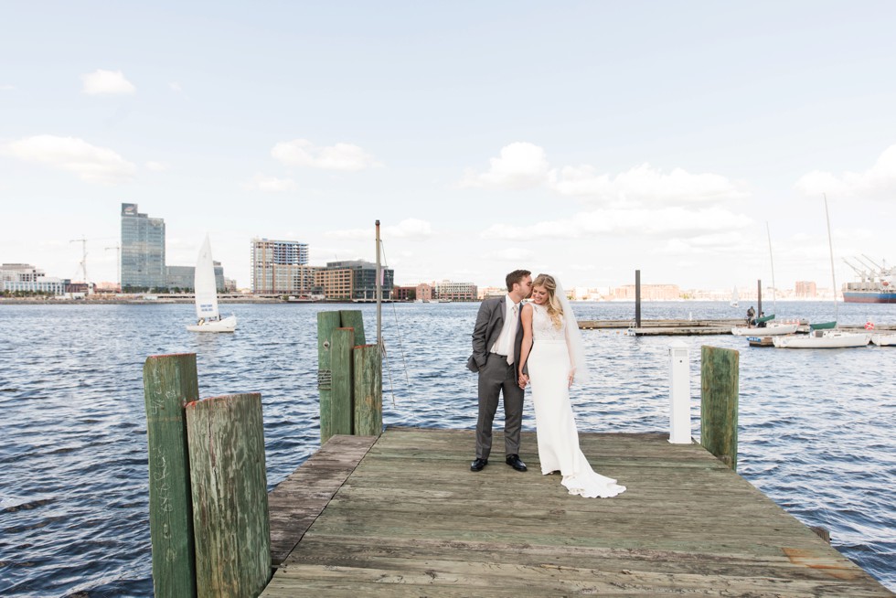 Baltimore Museum of Industry wedding photos with a sailboat on the baltimore harbor