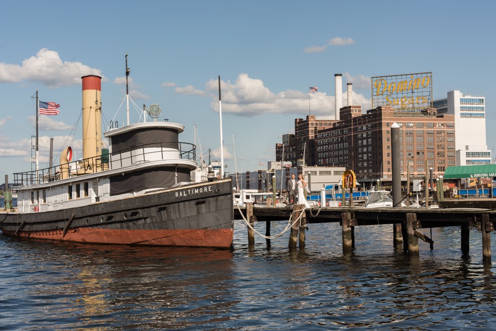 Baltimore Museum of Industry wedding photos with a tugboat on the baltimore harbor