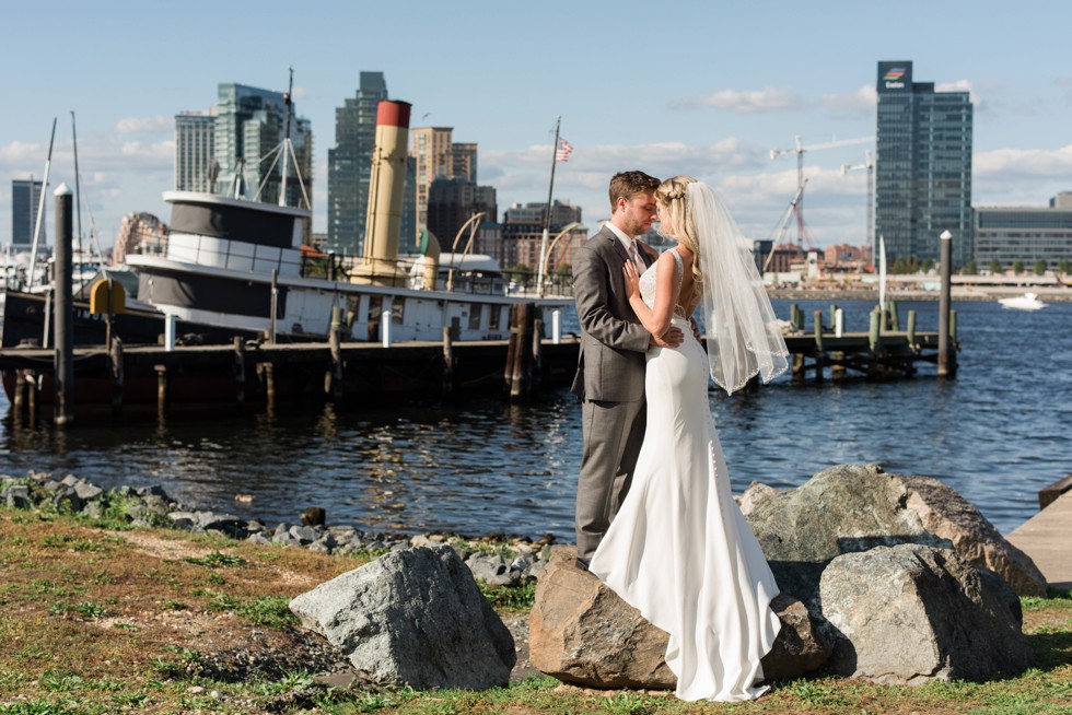 Bride and Groom standing on rocks at the Baltimore Museum of Industry