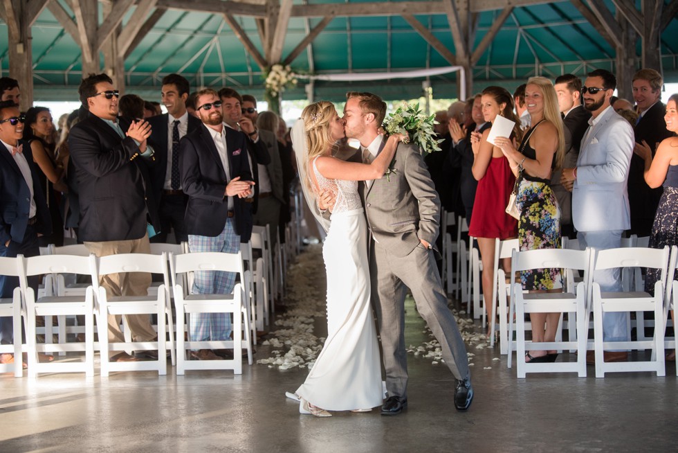 Wedding ceremony overlooking the Baltimore Harbor under the wooden barn at BMI