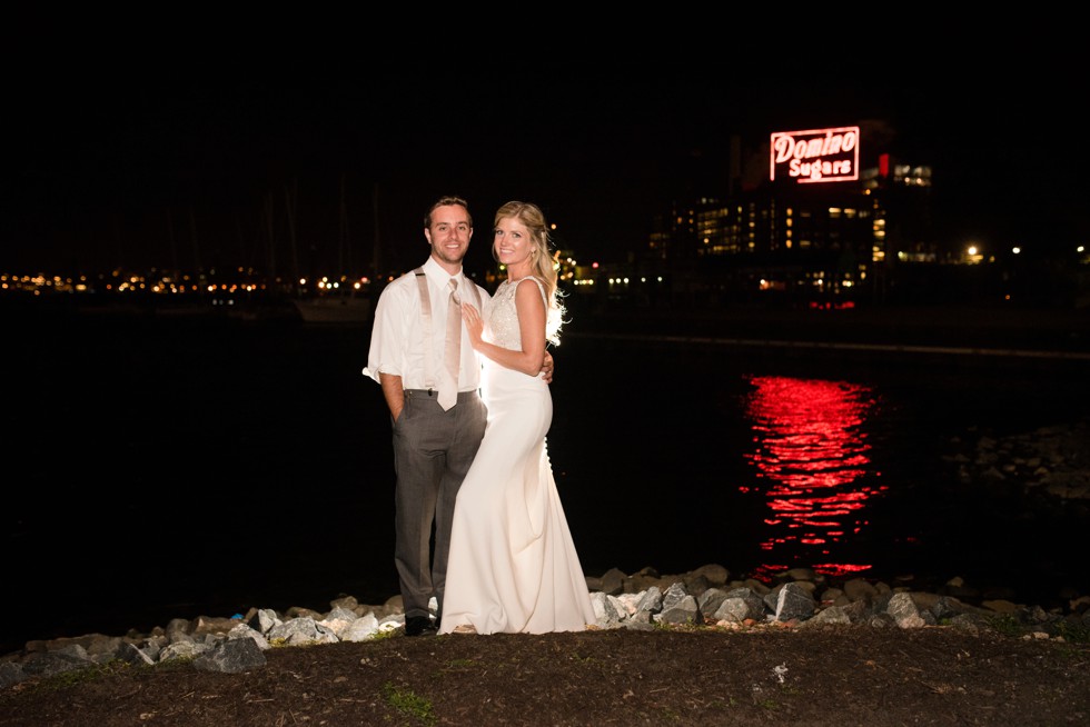 Baltimore Museum of Industry night photo of the newlyweds in front of Domino Sugar Sign