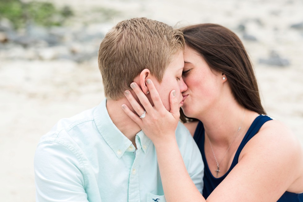 Two brides sitting in the sand on the Jersey Shore of Barnegat Lighthouse