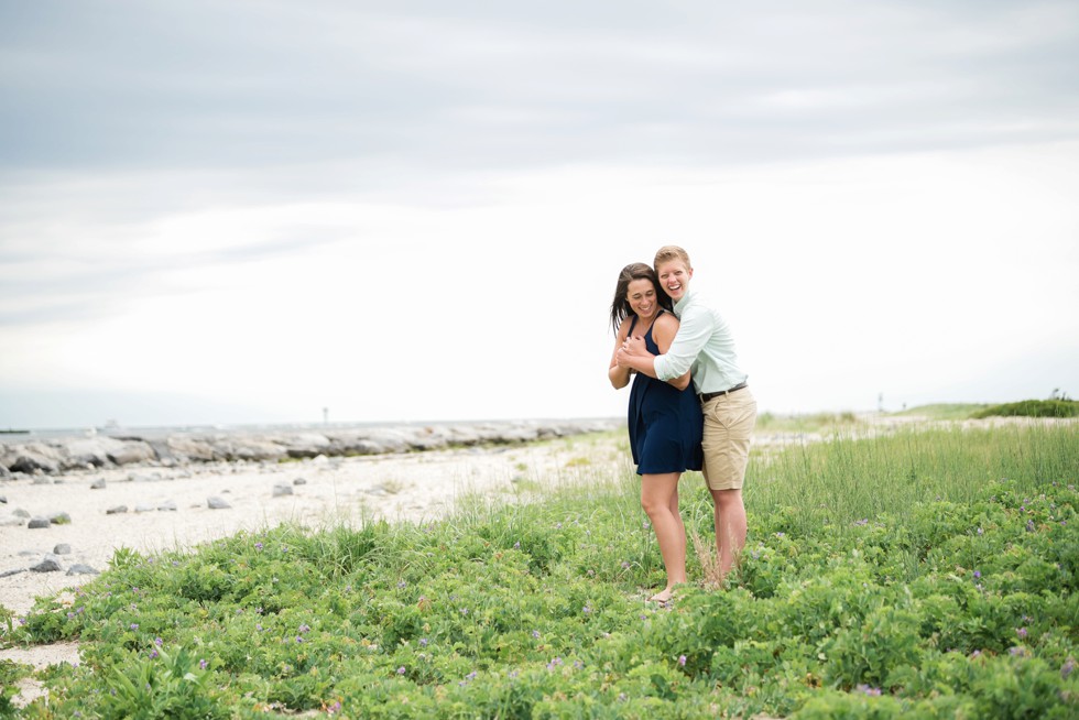 Proposal photos of two brides to be on the beach