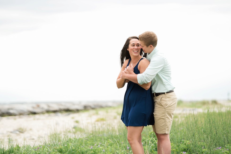 Proposal photos of two brides to be on the beach