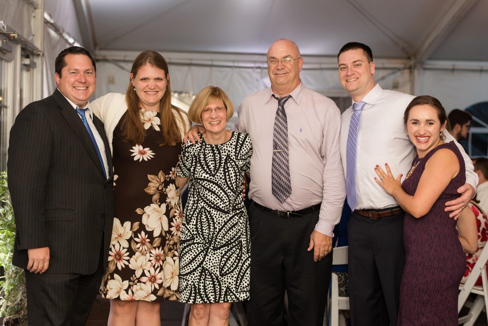 Family photos at tented ballroom reception