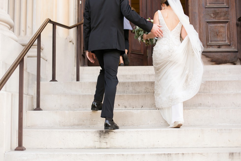 Bride and Groom walking into Peabody Library for ceremony