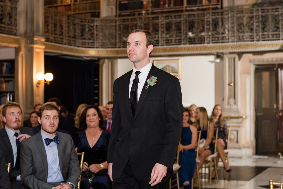 Groom walking down the aisle at peabody library ceremony