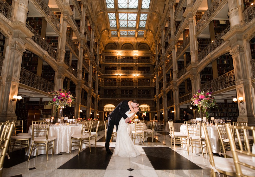 Evening romantic night portrait of bride and groom in Peabody Library wedding reception