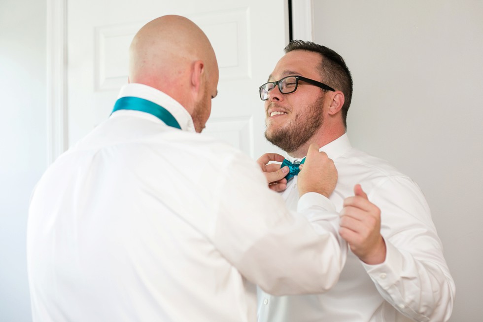 Groom in a teal bowtie at Anchor Inn wedding venue