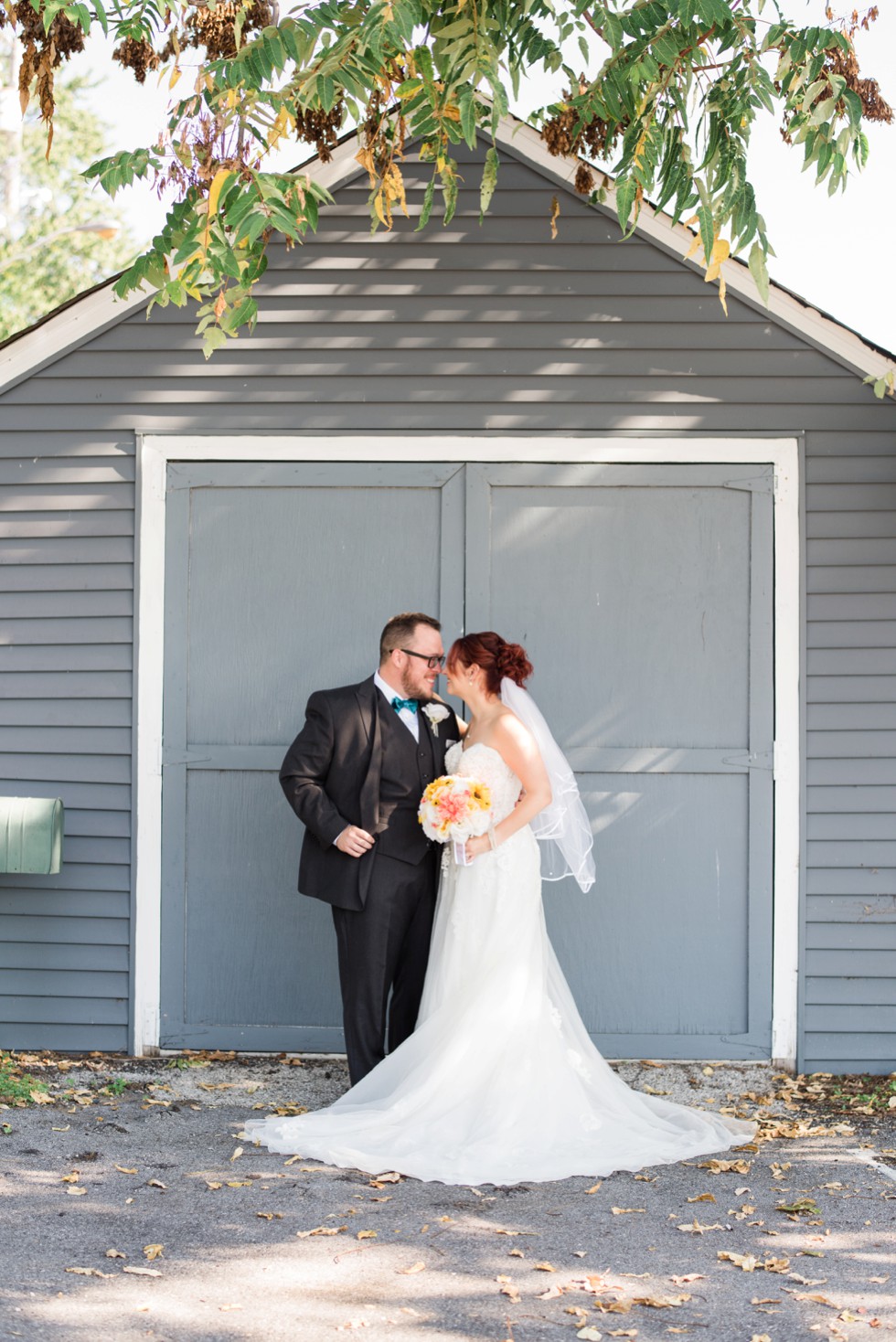 bride and groom portraits with a teal bowtie at Anchor Inn Wedding