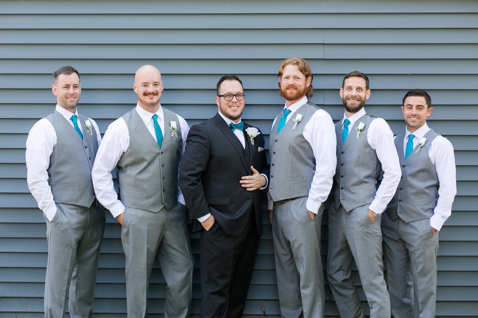 Groomsmen in grey vests and converse sneakers at Anchor inn Wedding in September