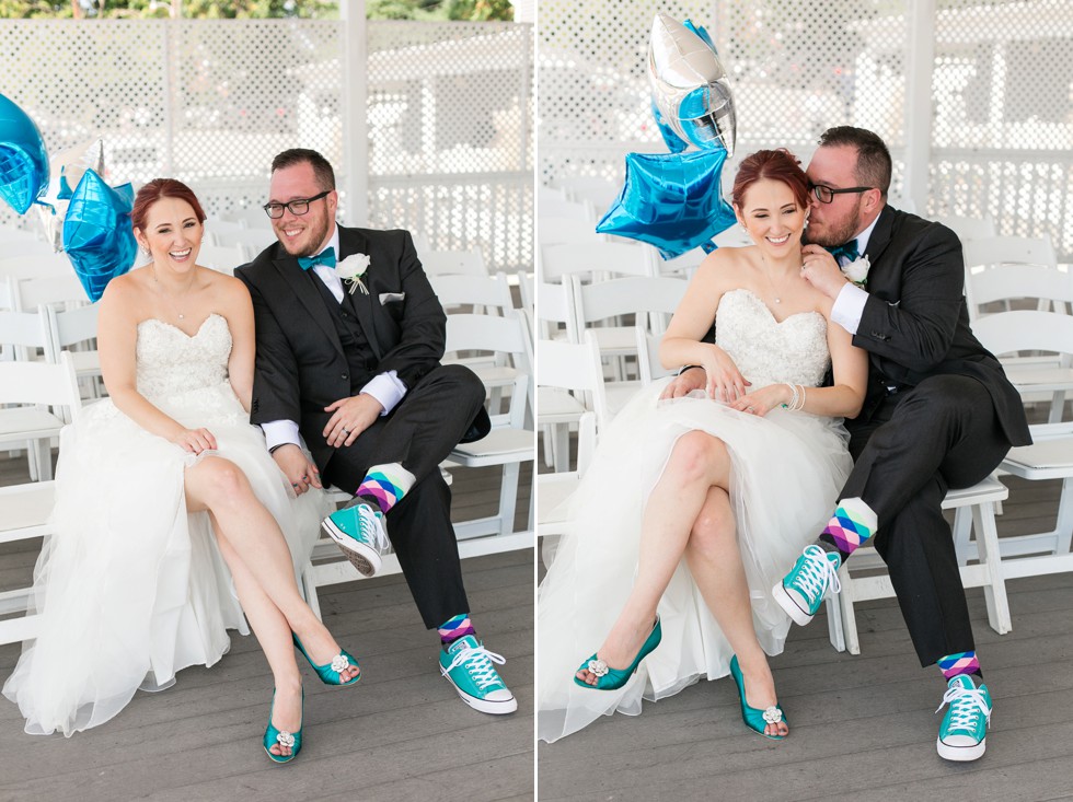 bride and groom being cute with balloons and teal bridal shoes