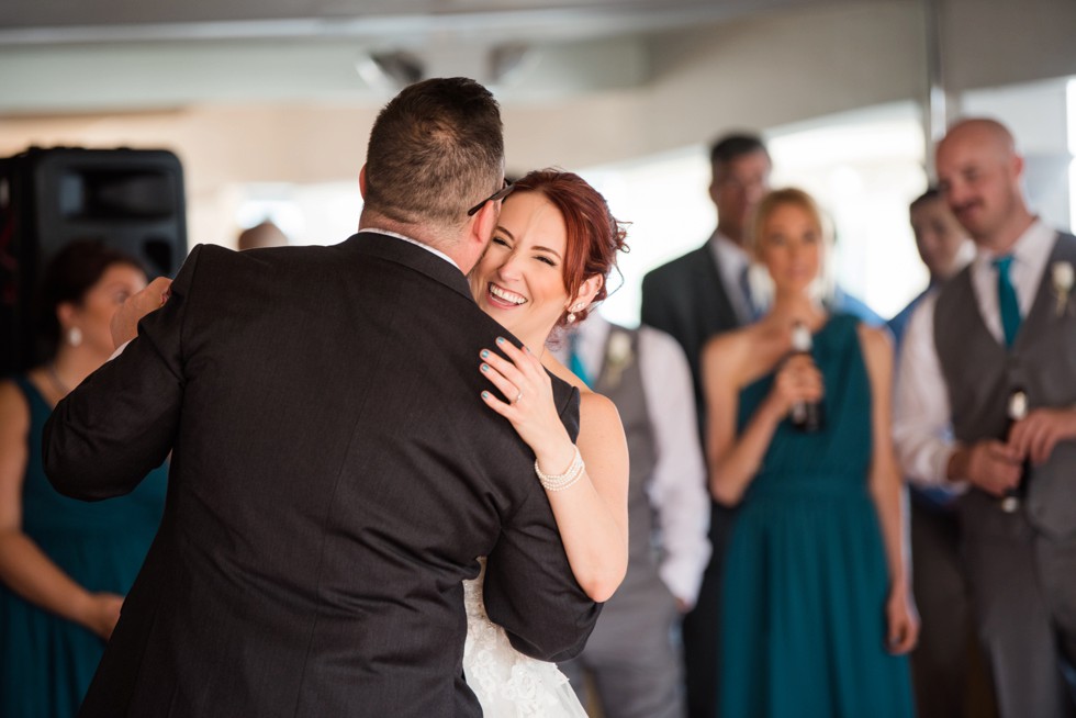 Bride and grooms first dance overlooking the water