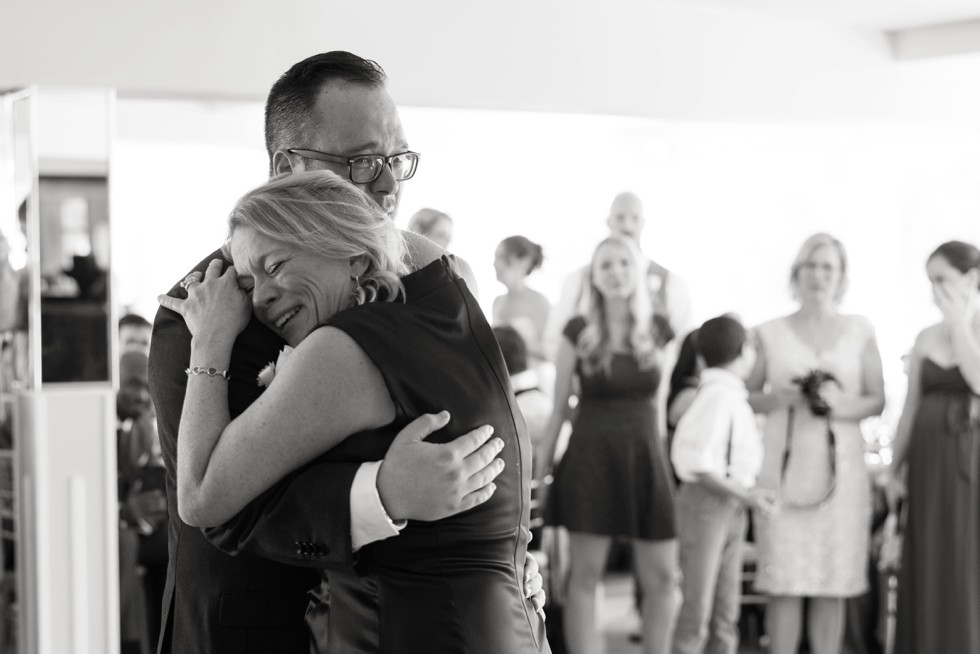 Mother son dance at venue overlooking the water In Philadelphia