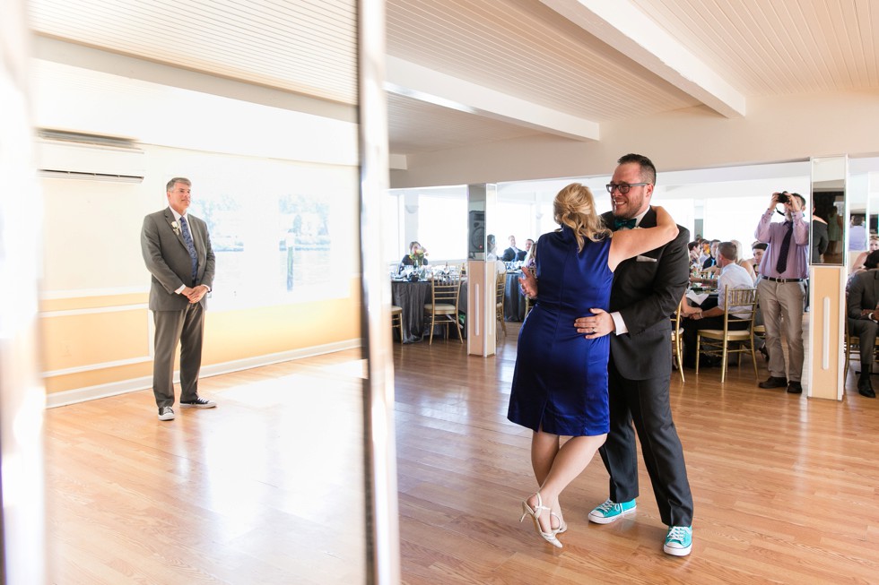 Mother son dance at venue overlooking the water In Philadelphia