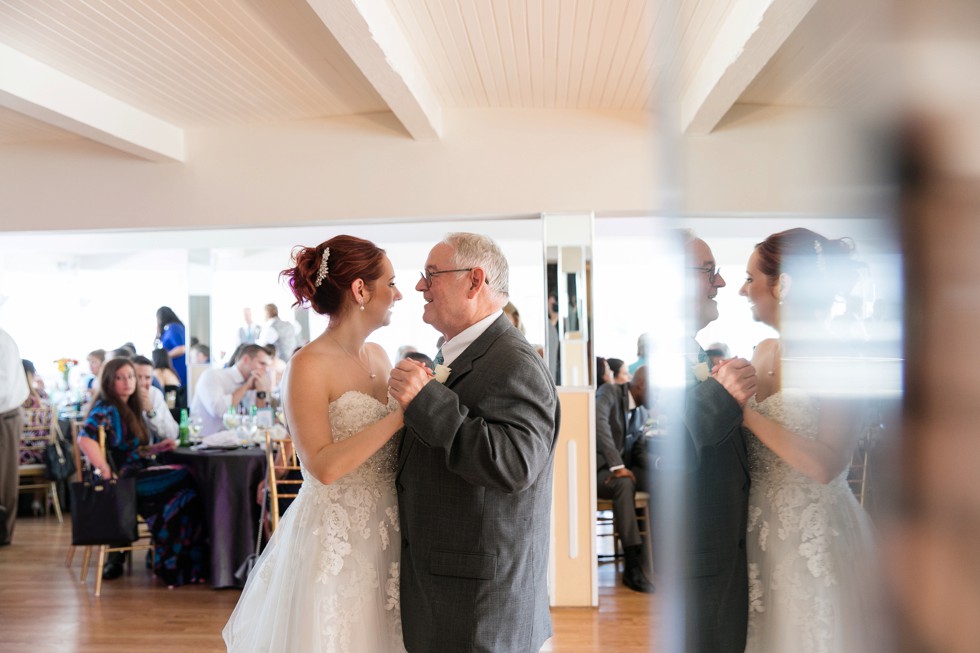 Father daughter dance at wedding reception on the water