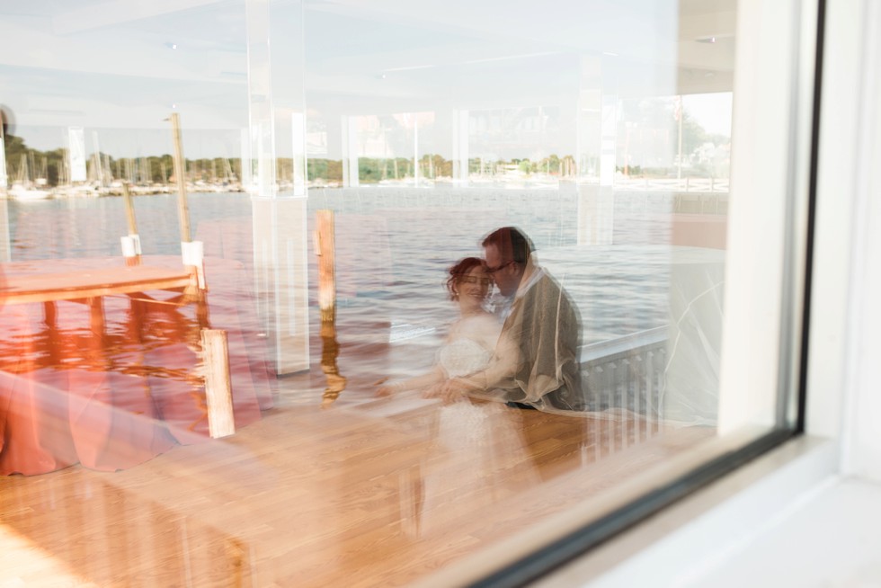 Bride and groom wedding portraits on the docks at Anchor Inn