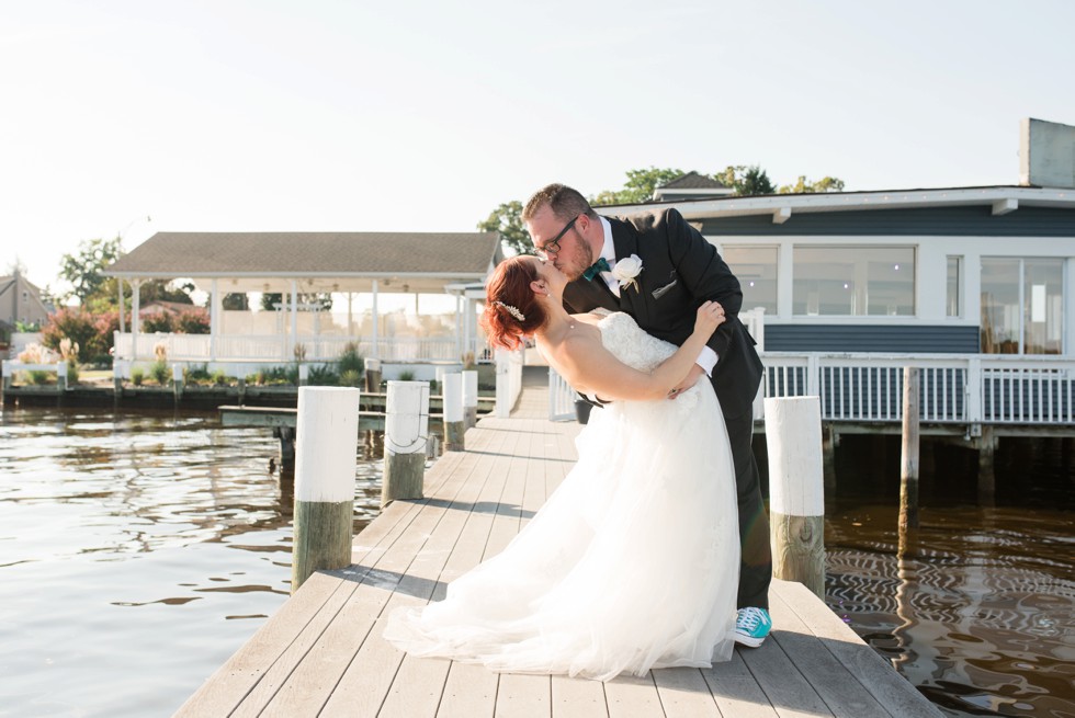 Bride and groom wedding portraits on the docks at Anchor Inn