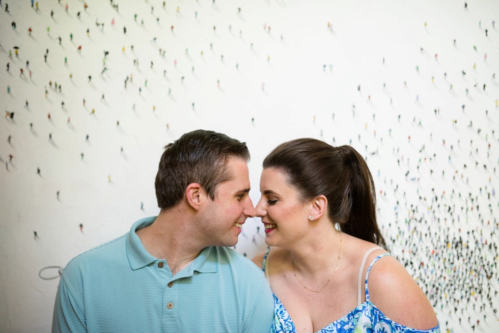 Engagement photos at home in front of famous artwork