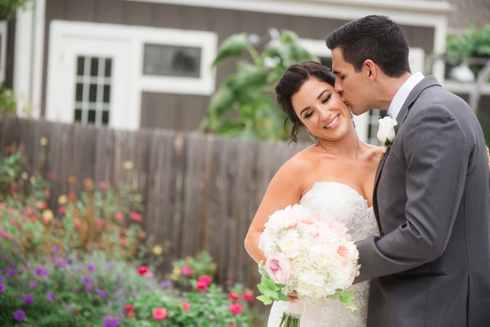 Wedding photo of couple kissing in the garden