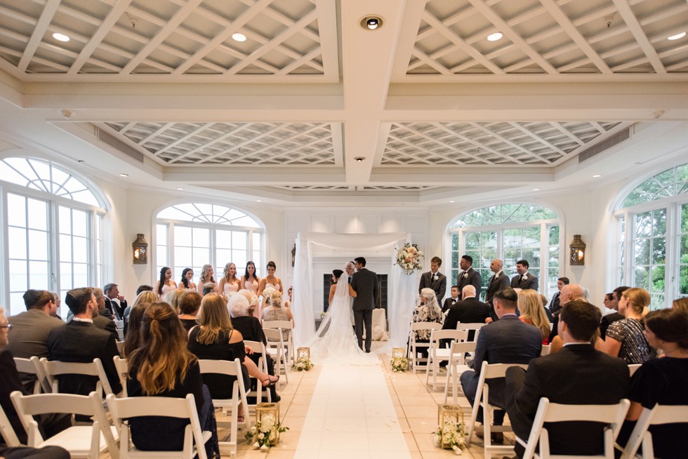 Rainy wedding ceremony indoors at the Chesapeake Bay Beach Club