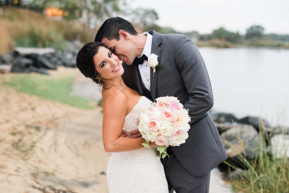 Groom dipping the bride on the beach