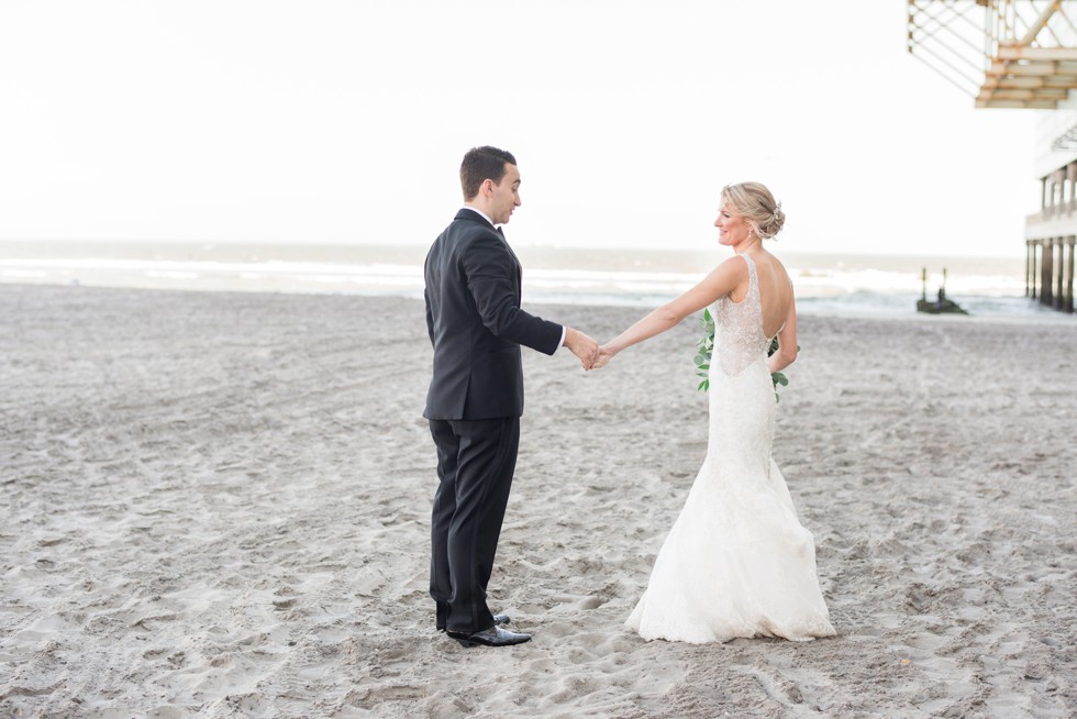 Newlyweds walking down the Atlantic City beach at One Atlantic Events