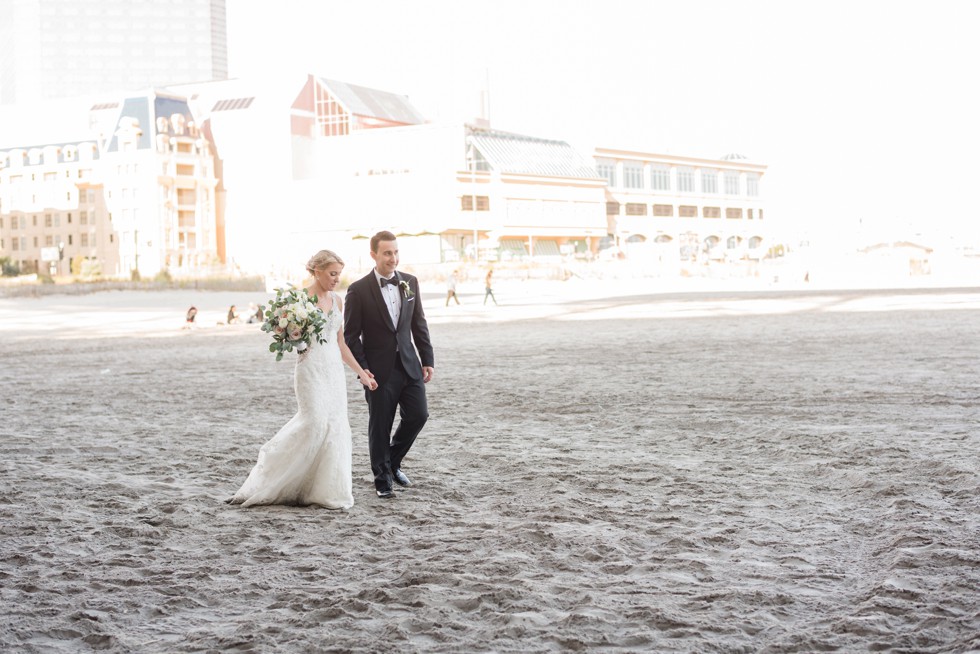 Newlyweds walking down the Atlantic City beach at One Atlantic Events