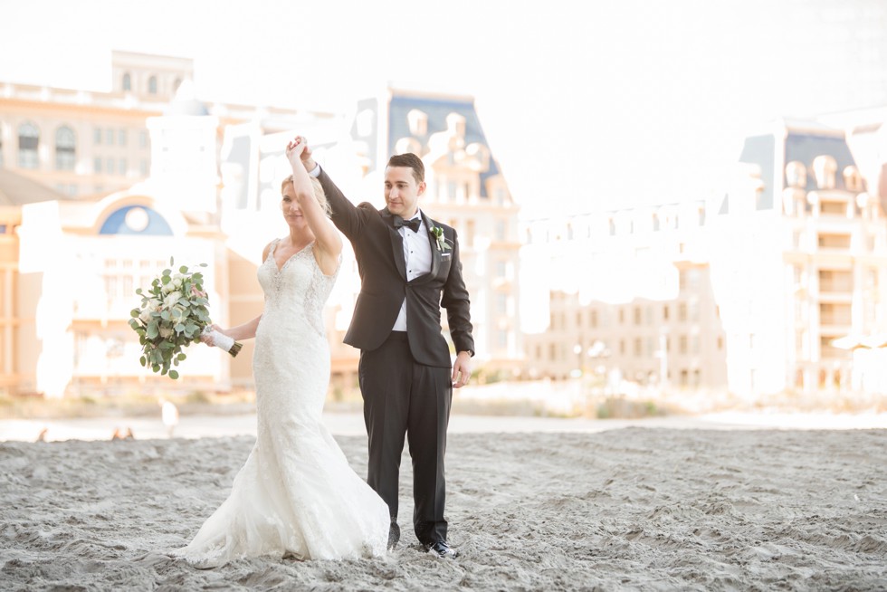 Newlyweds walking down the Atlantic City beach at One Atlantic Events