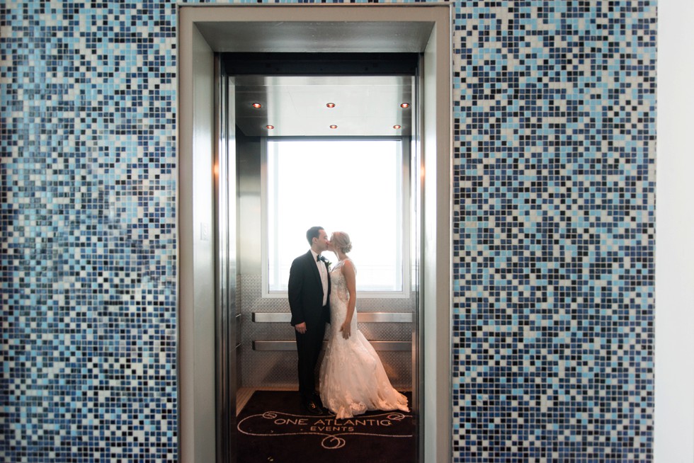 Bride and groom kissing in the elevator at One Atlantic Events