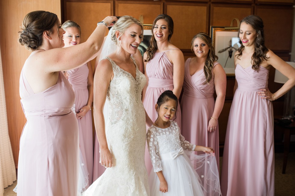 Bridesmaids putting the bride's veil on at Sheraton Hotel Atlantic City New Jersey Wedding