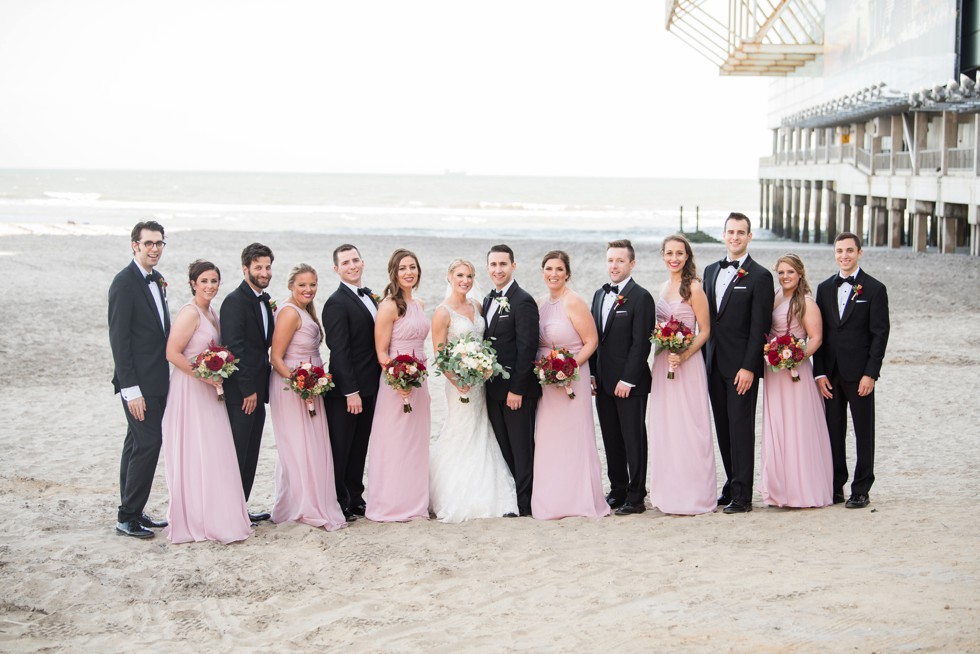 Wedding party in pink and black tux on the Atlantic City Boardwalk at One Atlantic